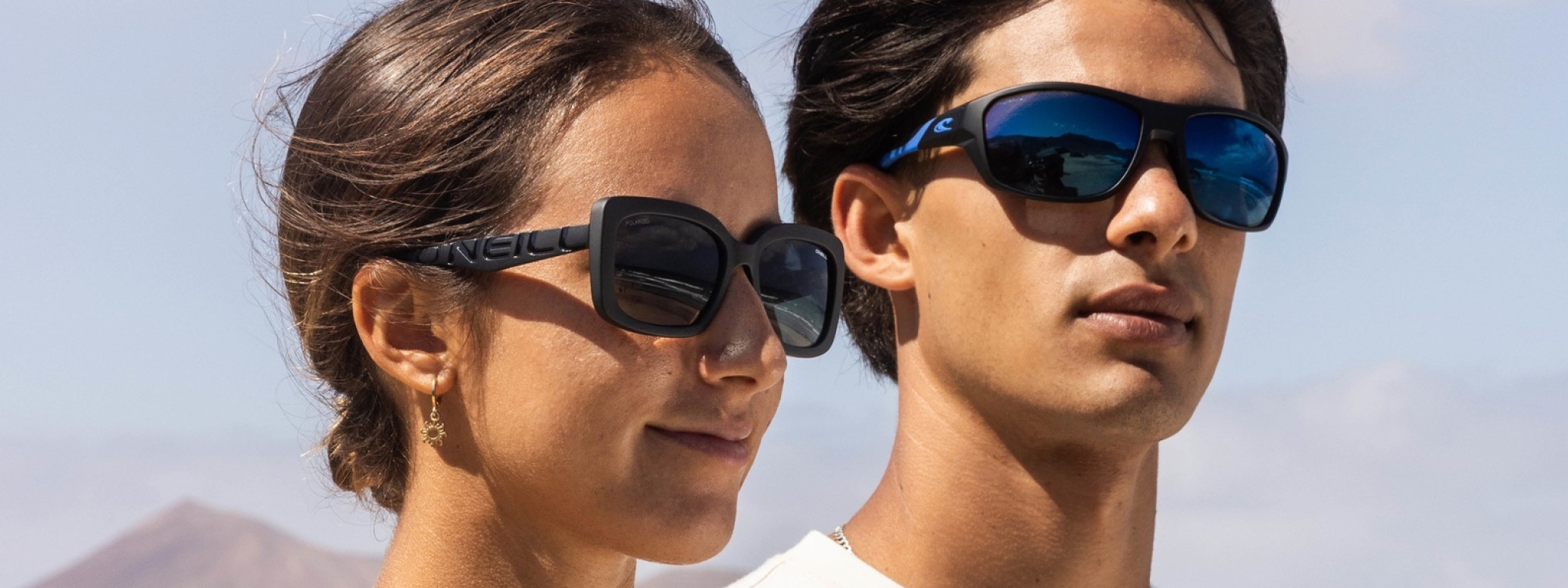 ONeill: Mann und Frau mit Sonnenbrillen